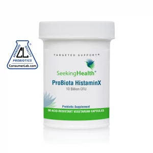 Tub of ProBiota HistaminX - 60 Vegetarian Capsules from Seeking Health with warning sign next to it on white background.